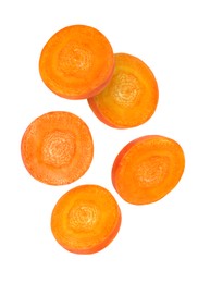 Image of Round carrot slices in air on white background