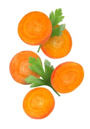 Round carrot slices and parsley in air on white background