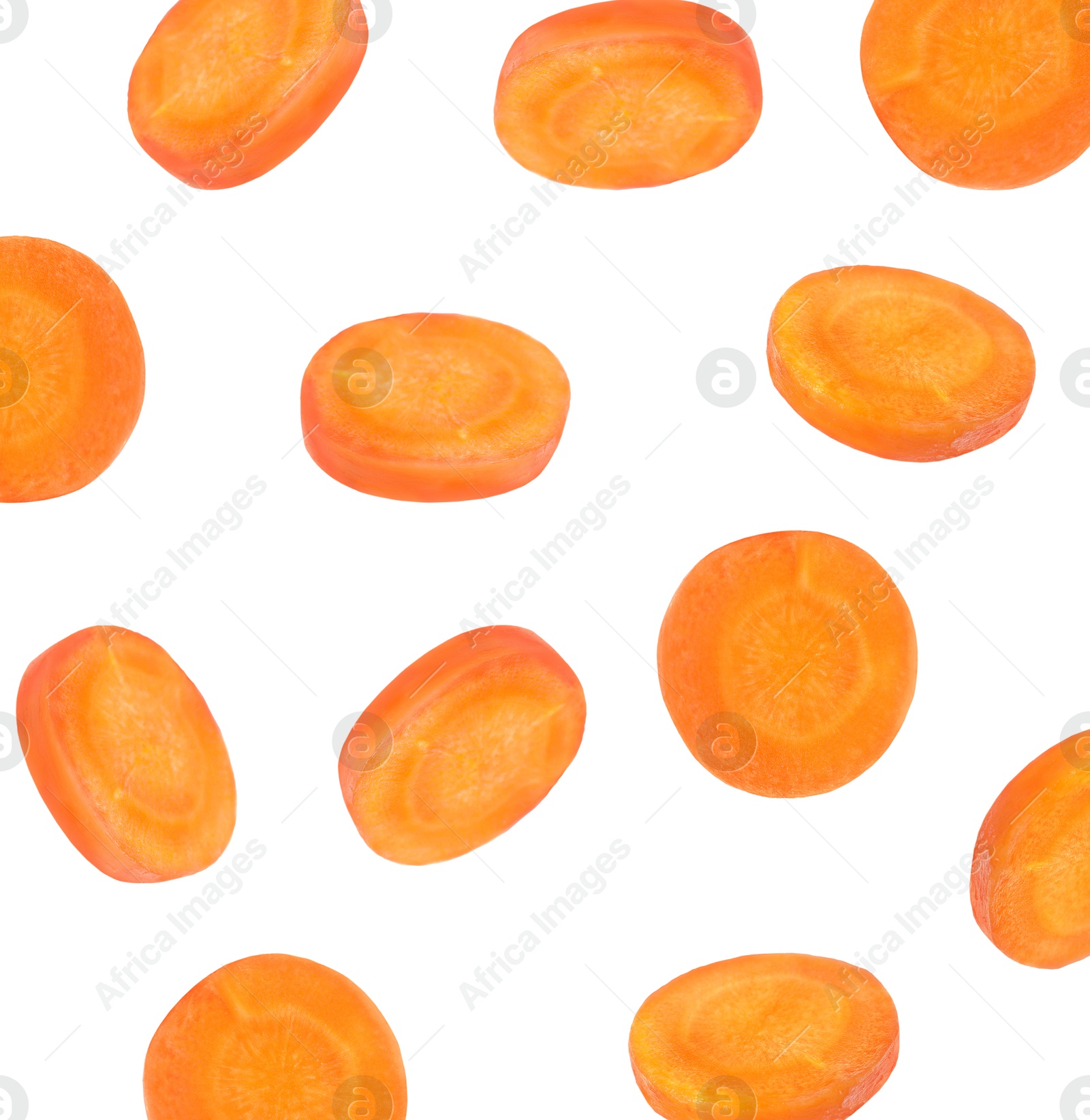 Image of Round carrot slices in air on white background