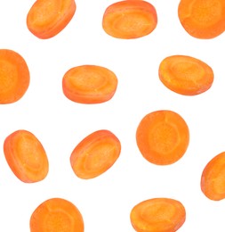 Image of Round carrot slices in air on white background