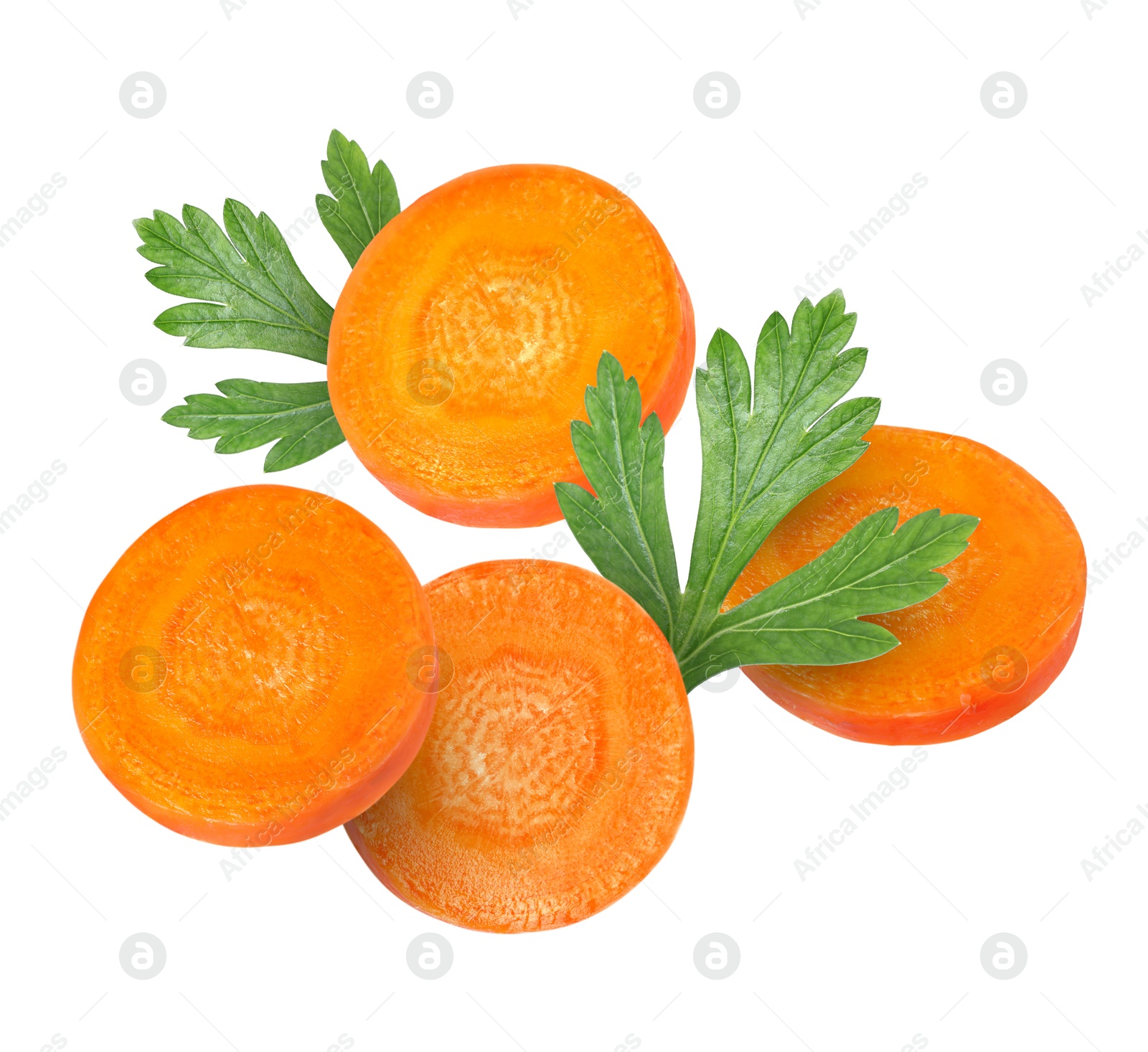 Image of Round carrot slices and parsley in air on white background