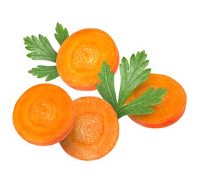 Image of Round carrot slices and parsley in air on white background