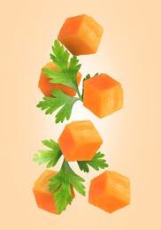 Image of Carrot cubes and parsley in air on dark beige background