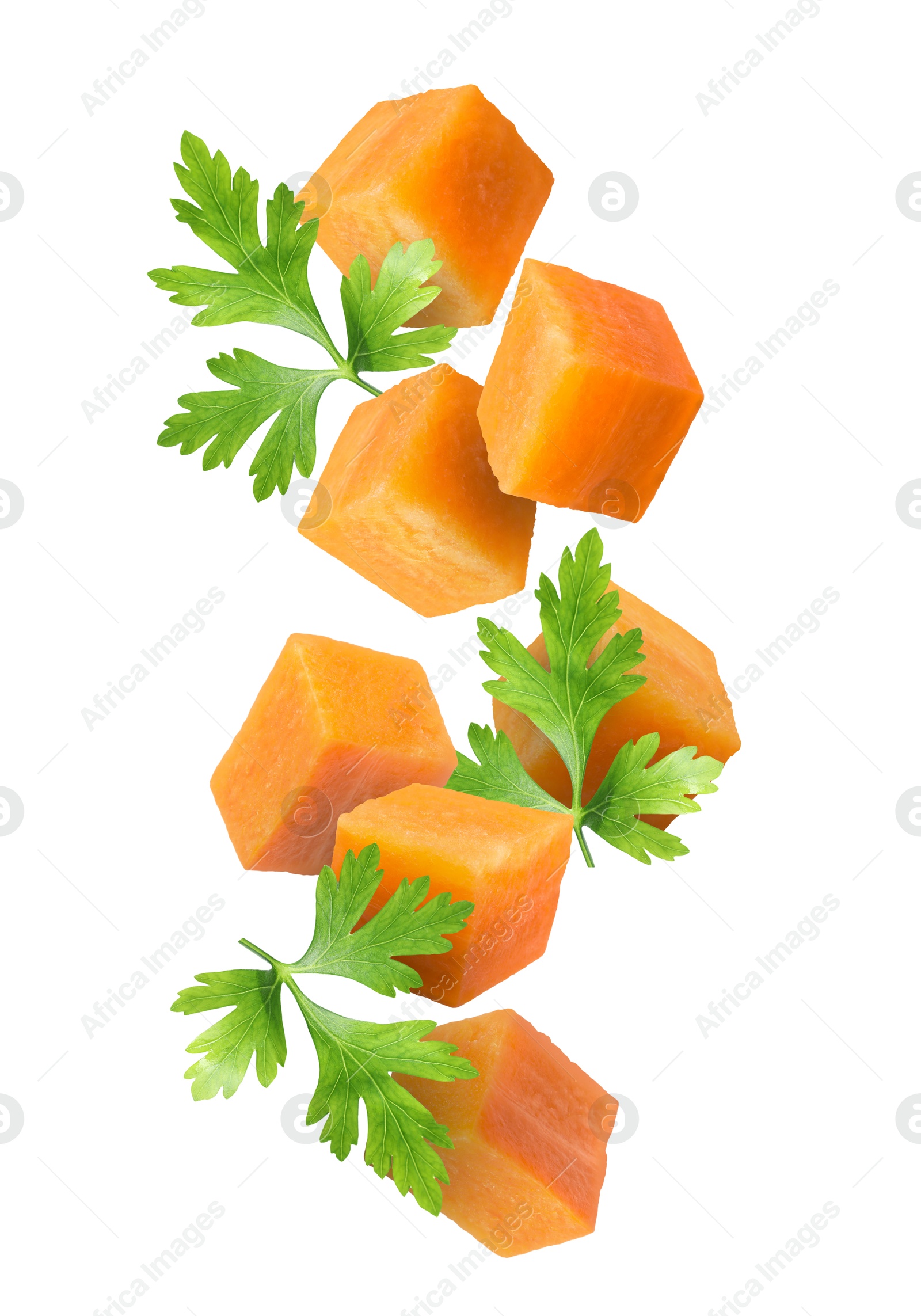 Image of Carrot cubes and parsley in air on white background