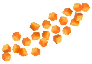 Image of Carrot cubes in air on white background