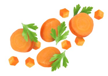 Image of Sliced carrot and parsley in air on white background