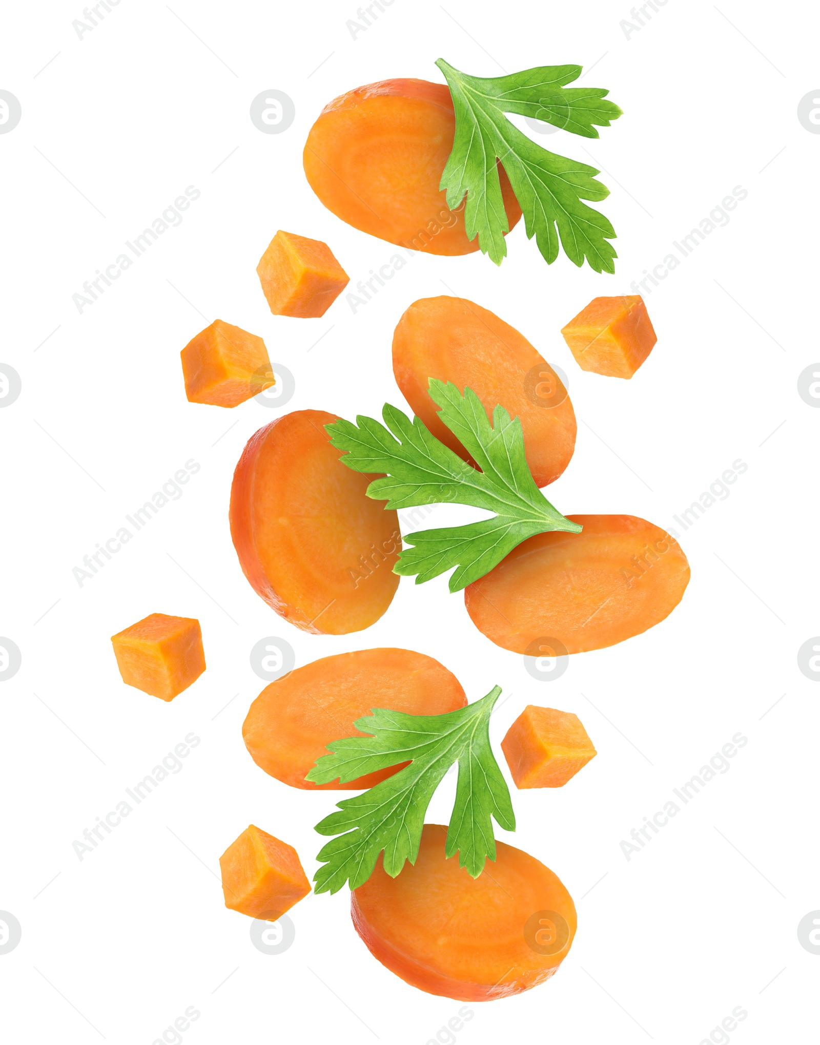 Image of Sliced carrot and parsley in air on white background