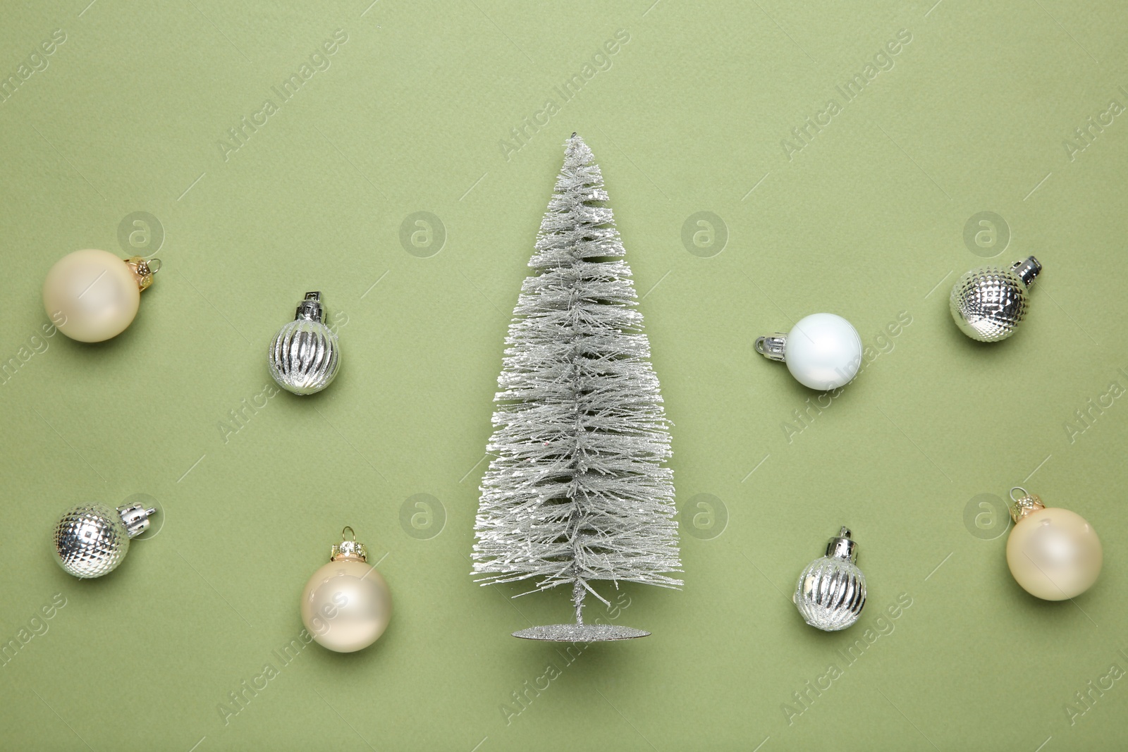 Photo of Flat lay composition with Christmas decor on green background