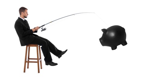 Image of Businessman catching piggy bank with fishing rod on white background. Money chase, business success concepts