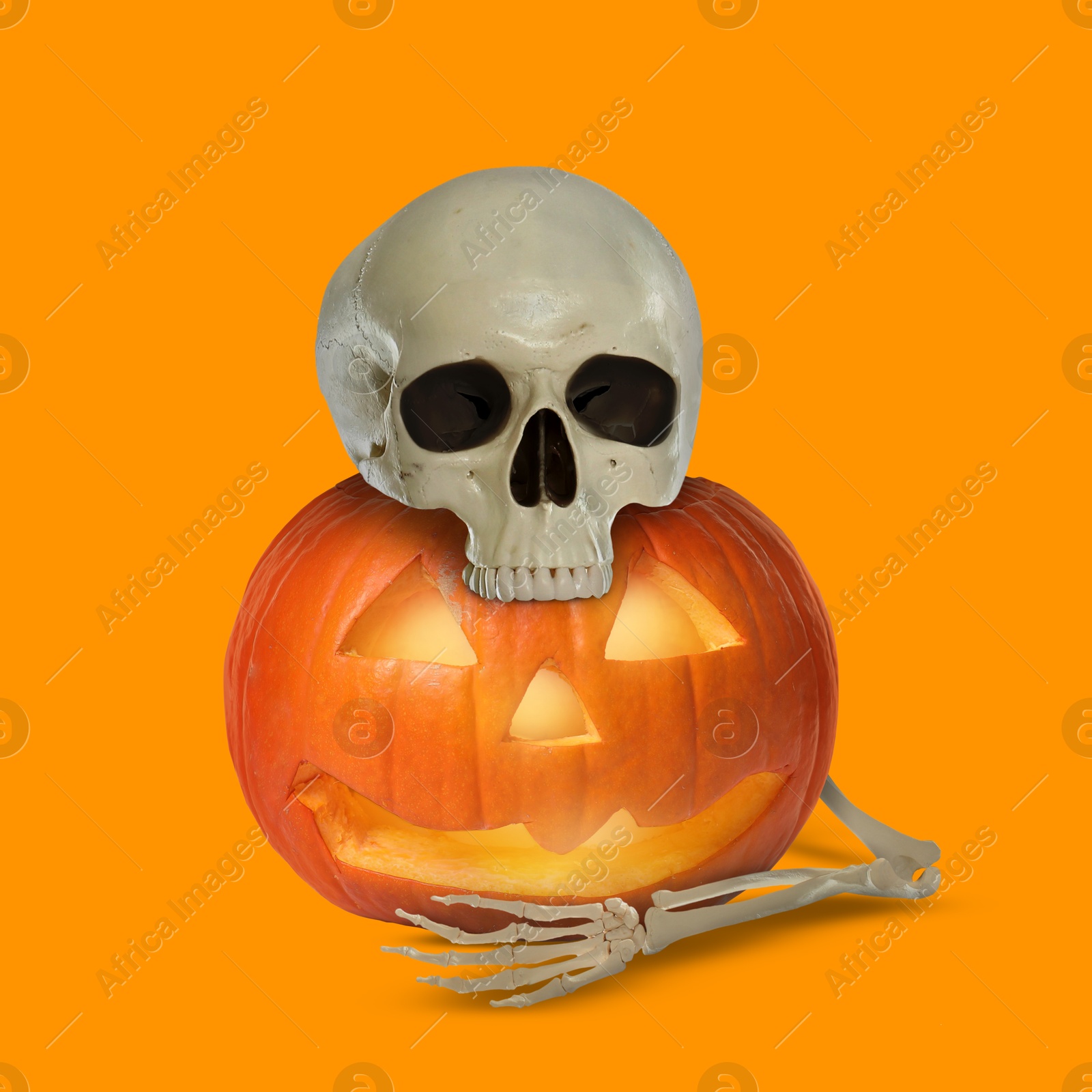 Image of Scary skeleton hugging spooky jack o'lantern on orange background. Halloween celebration