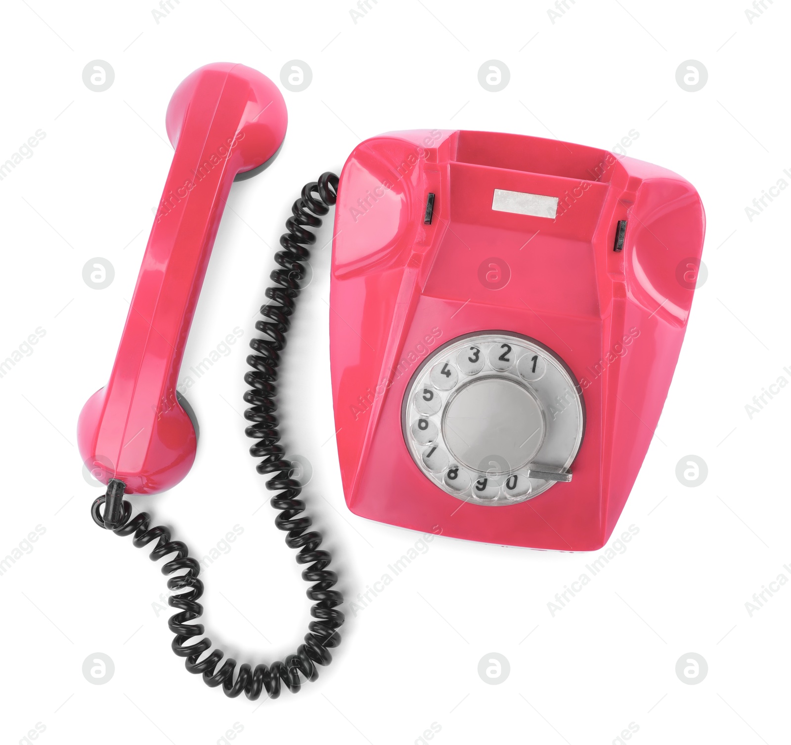 Image of Old pink telephone with rotary dial isolated on white, top view