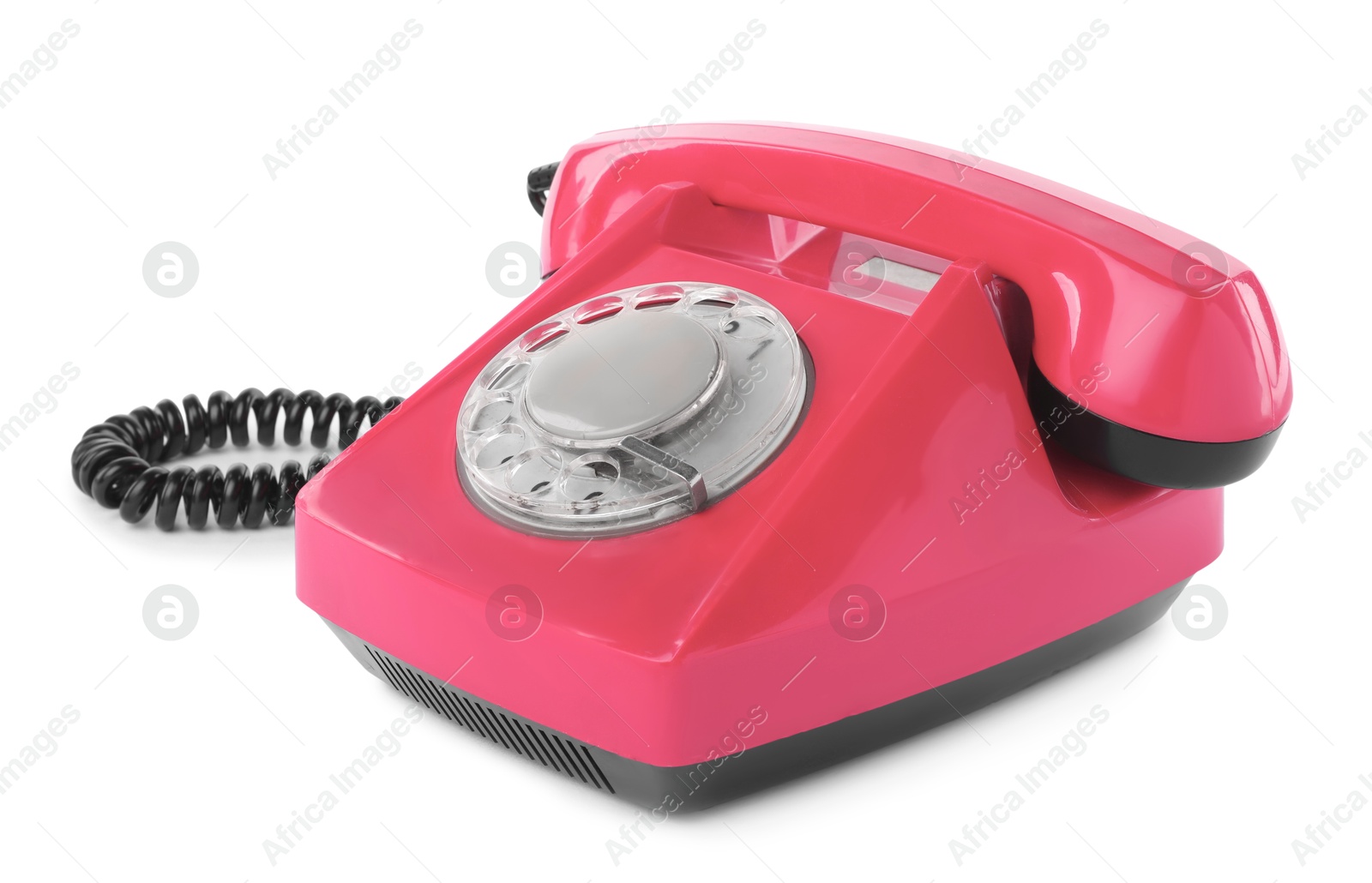 Image of Old pink telephone with rotary dial isolated on white