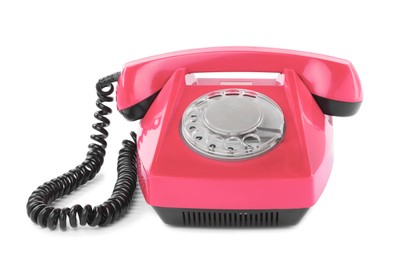 Image of Old pink telephone with rotary dial isolated on white