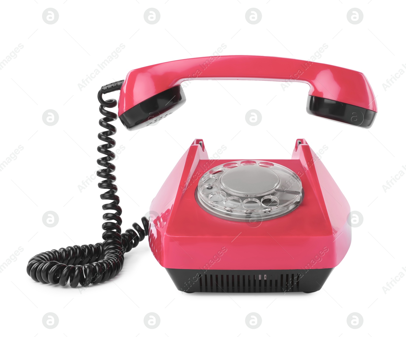 Image of Old pink telephone with rotary dial isolated on white