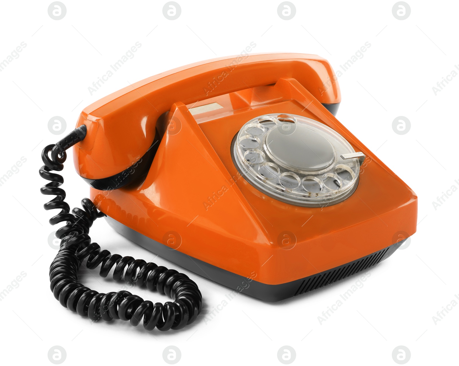 Image of Old orange telephone with rotary dial isolated on white