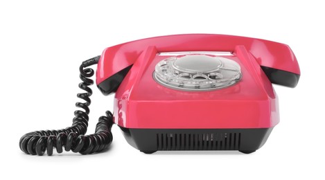 Image of Old pink telephone with rotary dial isolated on white