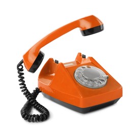 Image of Old orange telephone with rotary dial isolated on white