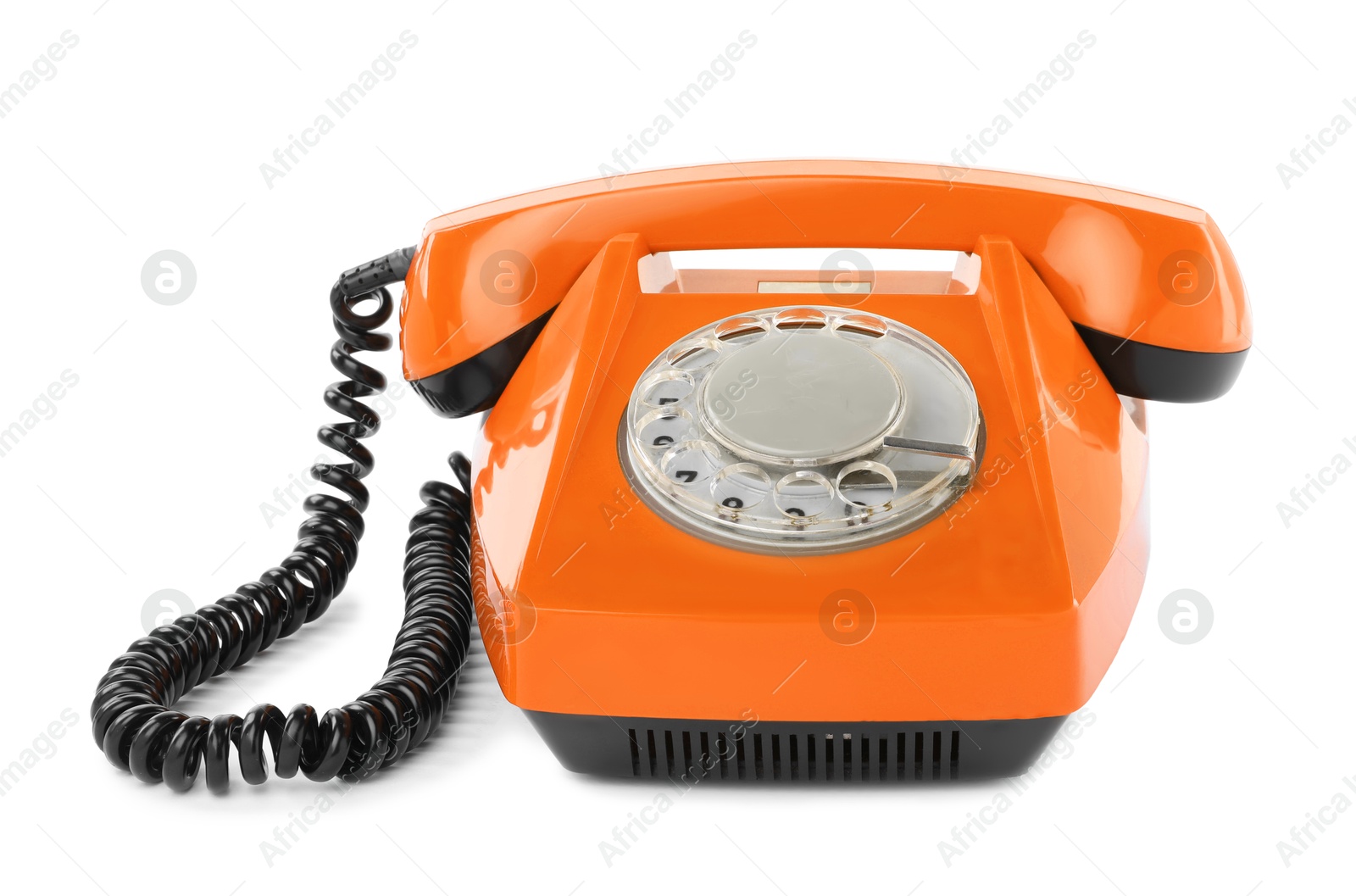 Image of Old orange telephone with rotary dial isolated on white