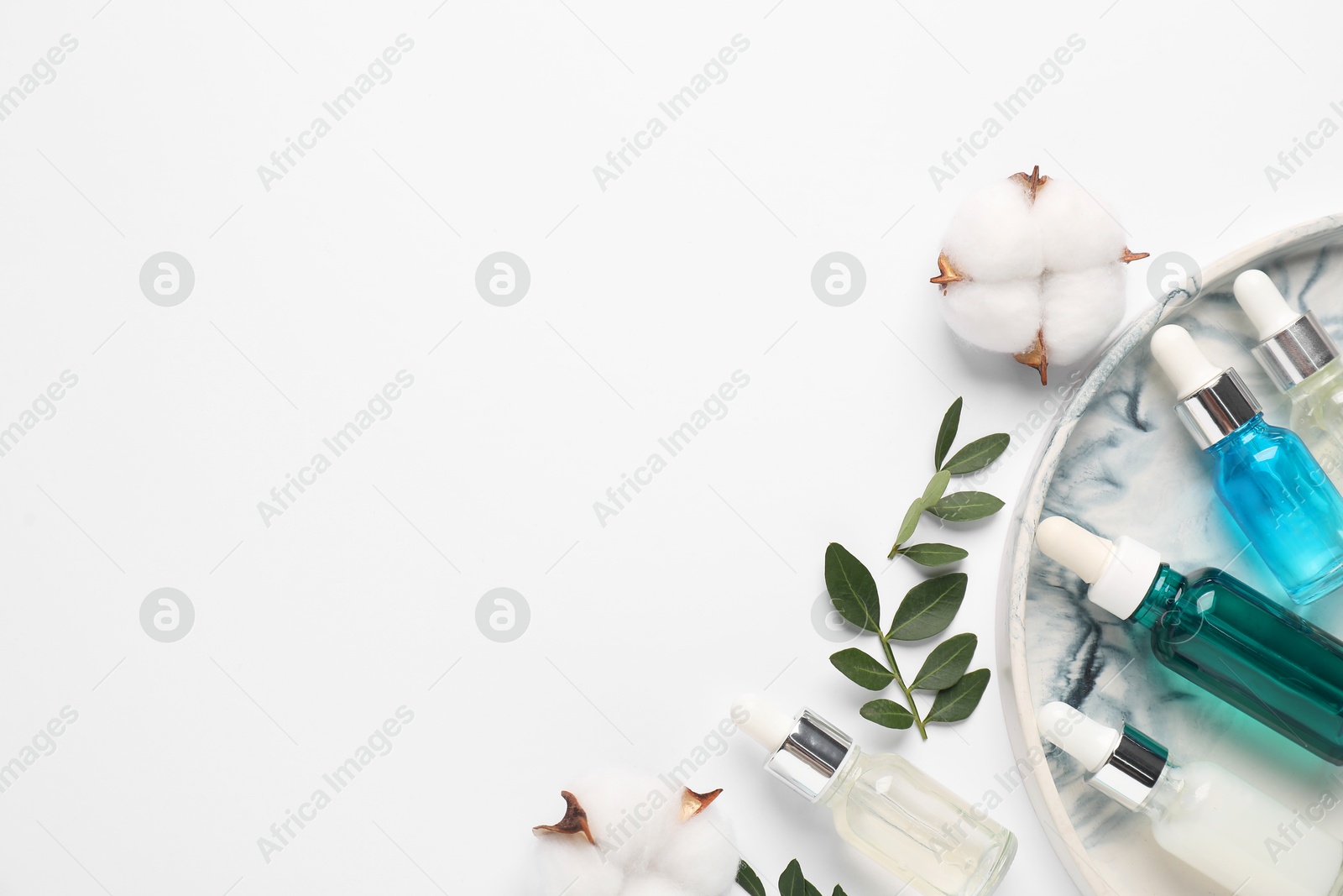 Photo of Different cosmetic products, cotton flowers and leaves on white background, flat lay. Space for text