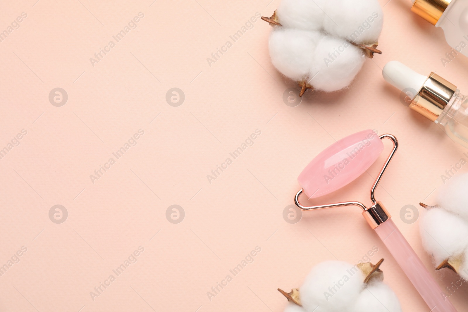 Photo of Different cosmetic products and cotton flowers on beige background, flat lay. Space for text