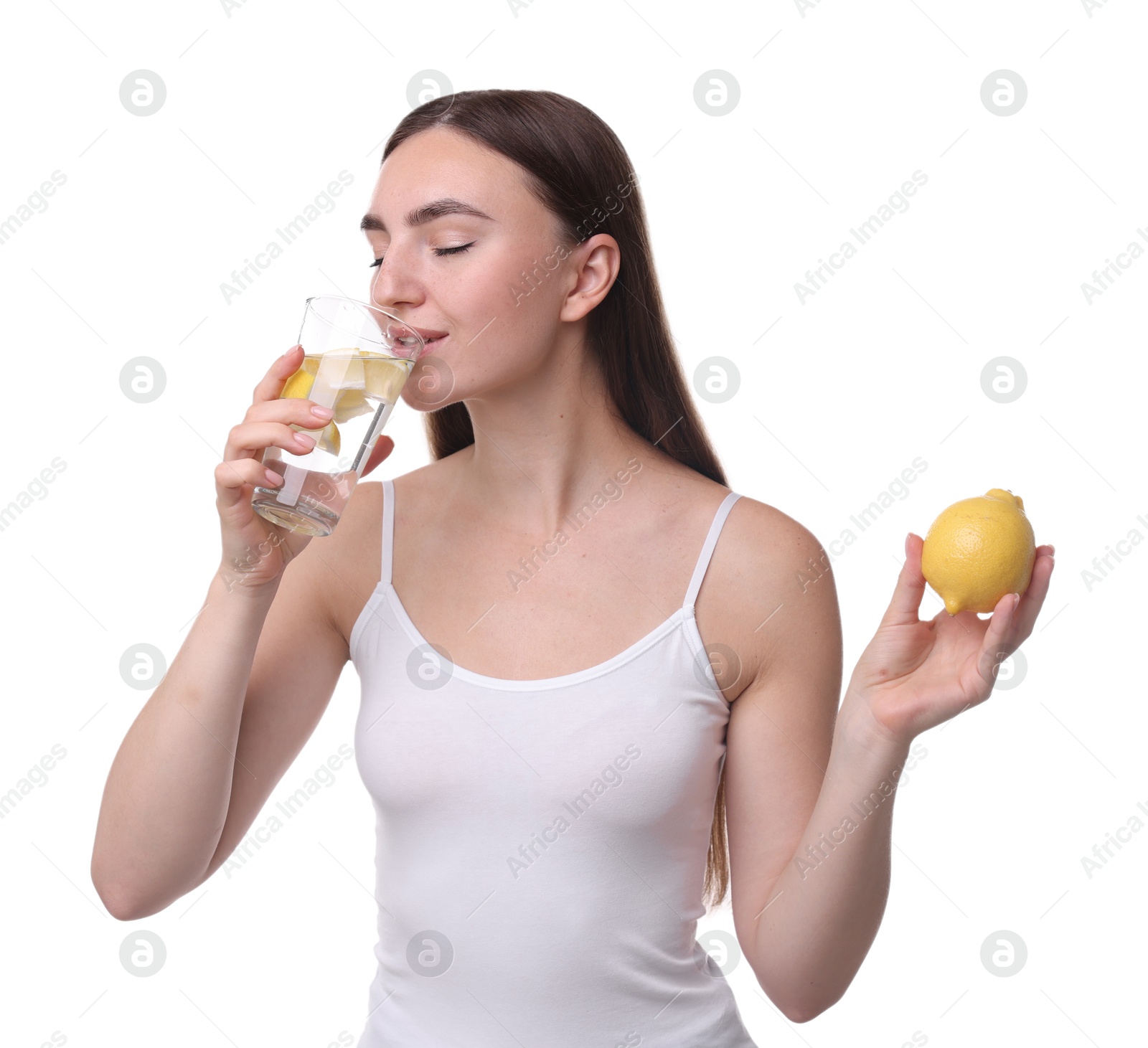 Photo of Woman with glass of lemon water and fruit on white background