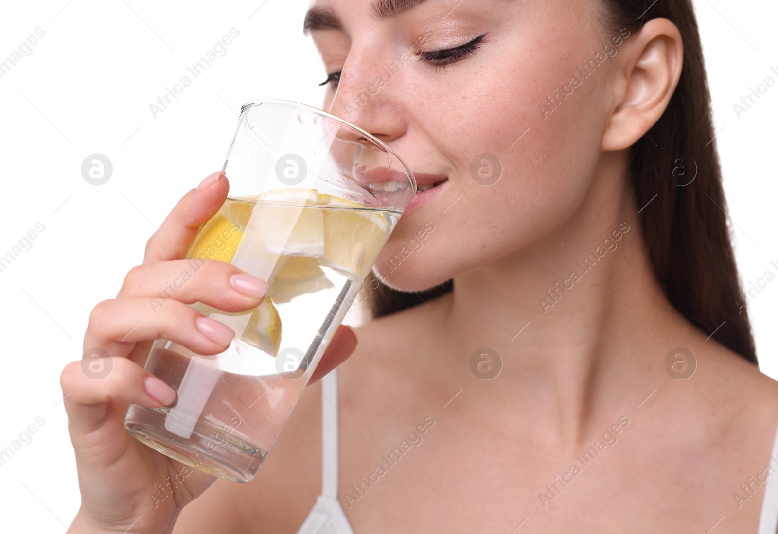 Photo of Woman drinking water with lemon on white background, closeup