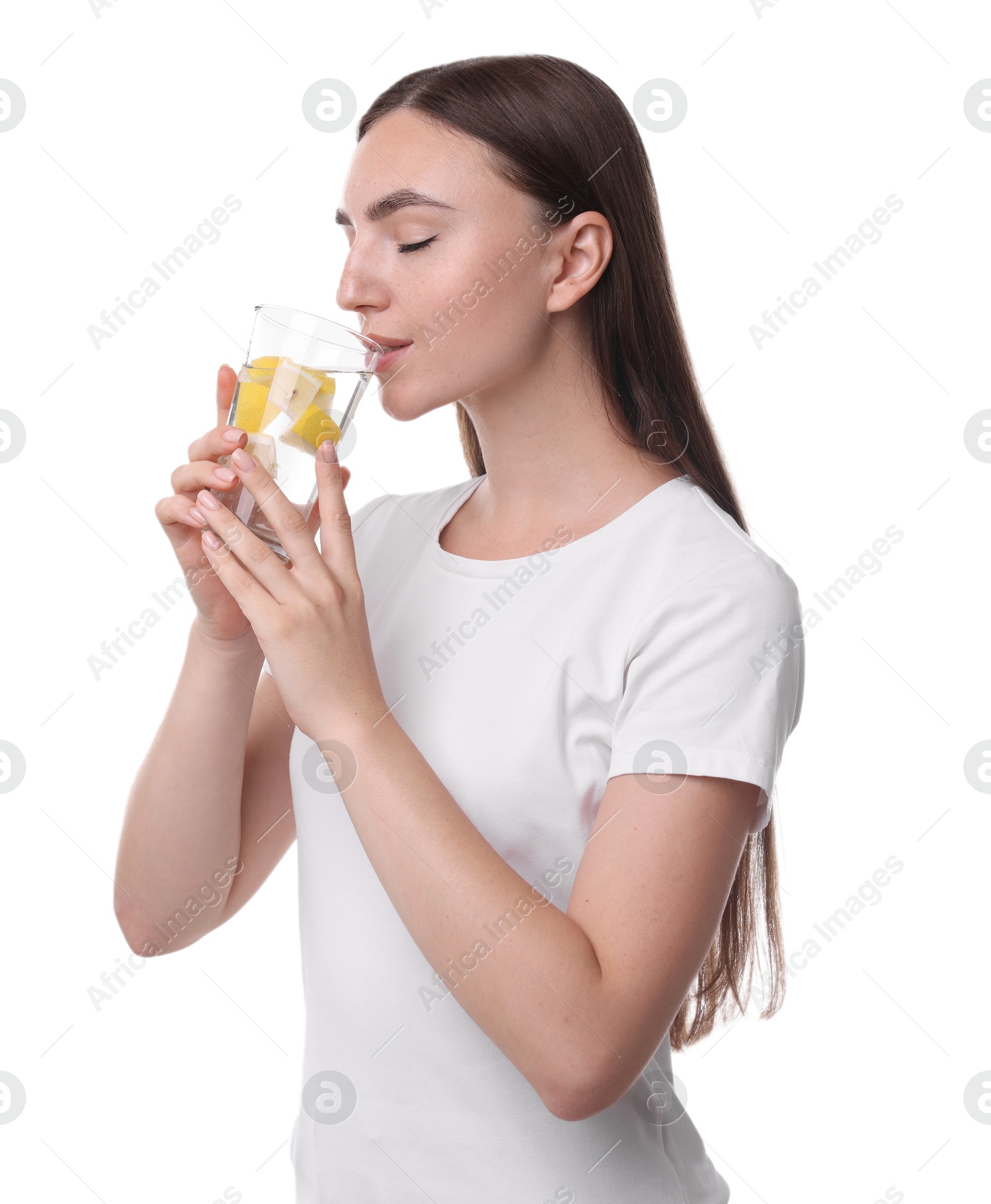 Photo of Woman drinking water with lemon on white background