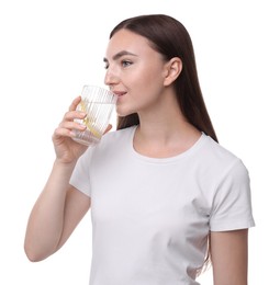 Photo of Woman drinking water with lemon on white background