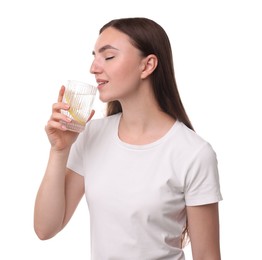 Woman drinking water with lemon on white background