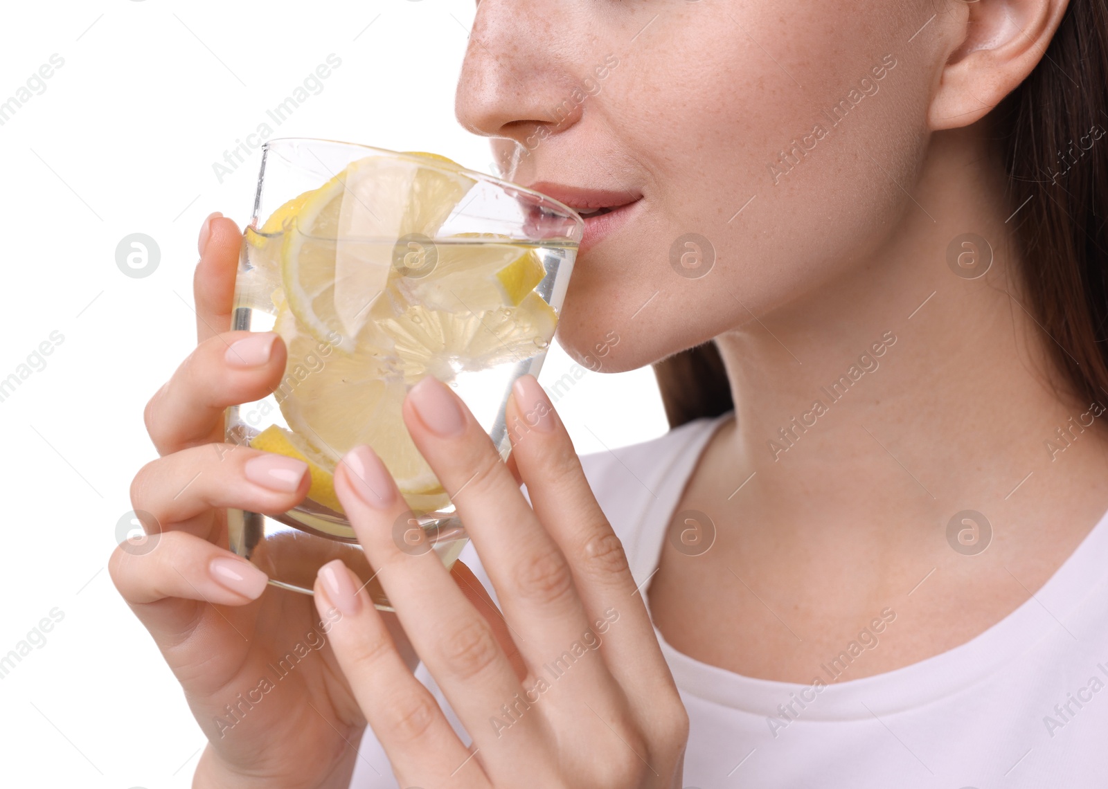 Photo of Woman drinking water with lemon on white background, closeup