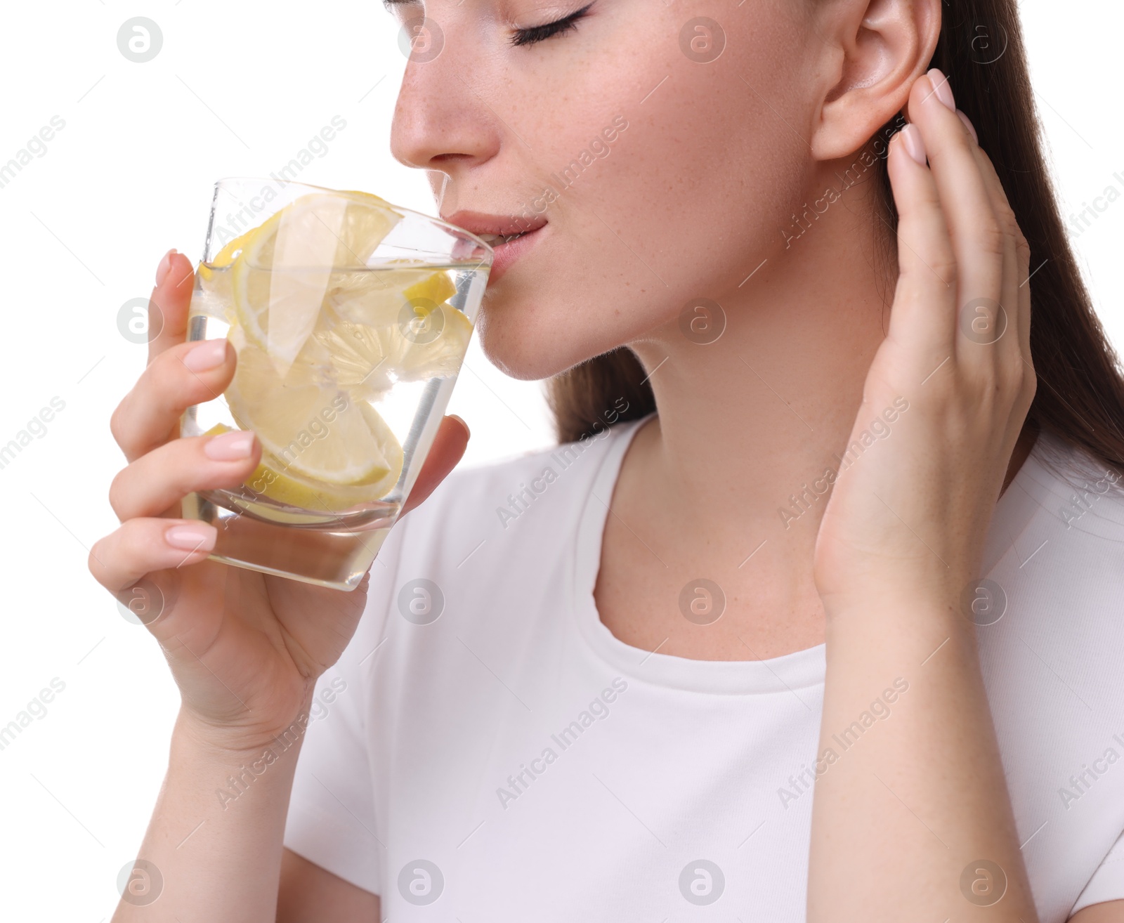 Photo of Woman drinking water with lemon on white background, closeup