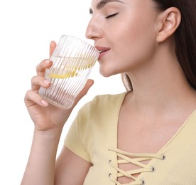 Photo of Woman drinking water with lemon on white background, closeup