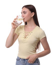 Photo of Woman drinking water with lemon on white background