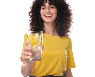 Woman with glass of lemon water on white background, selective focus