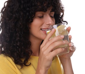 Woman drinking water with lemon on white background