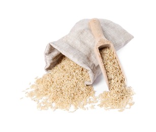 Photo of Raw rice in burlap with scoop isolated on white