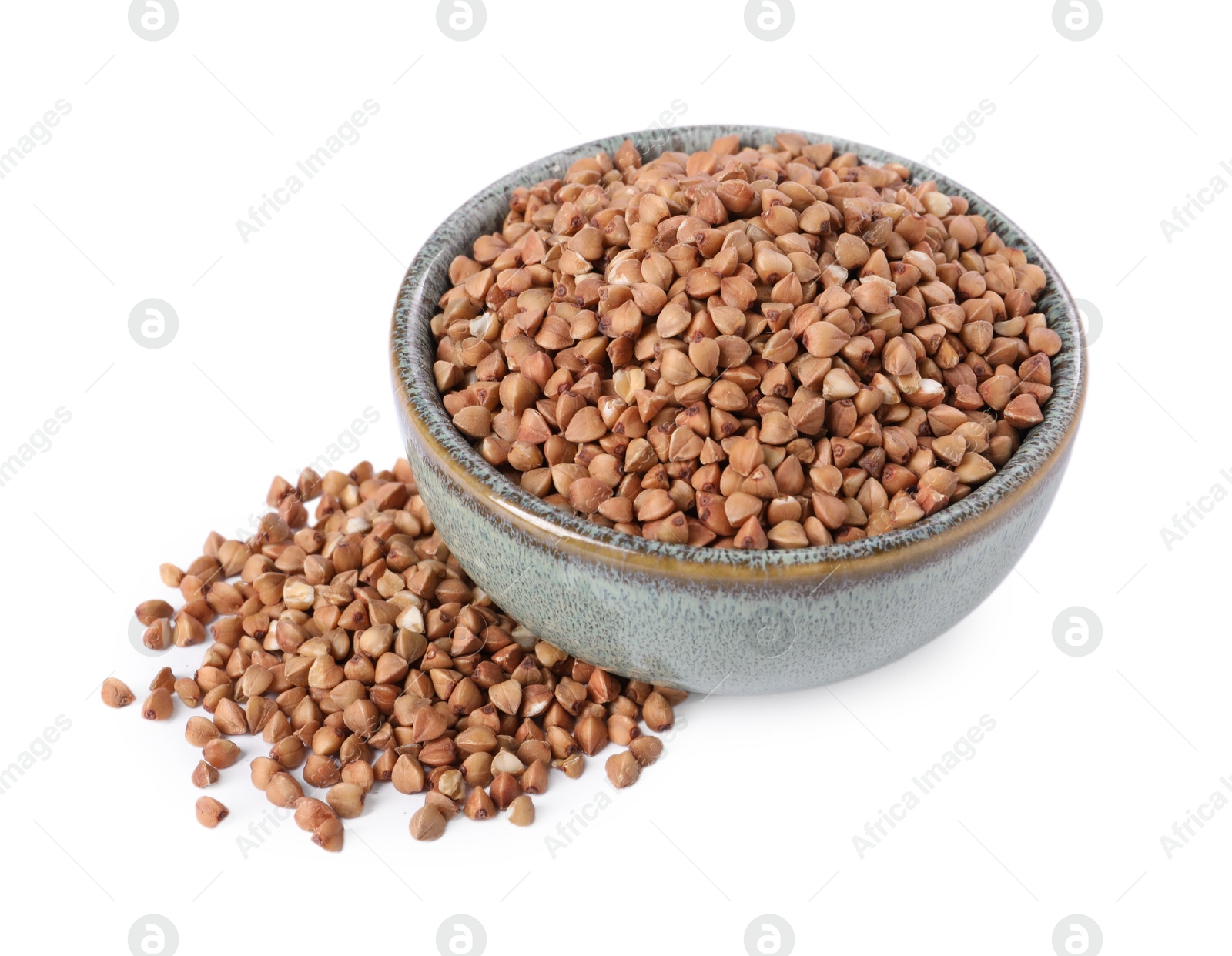 Photo of Raw buckwheat in bowl isolated on white