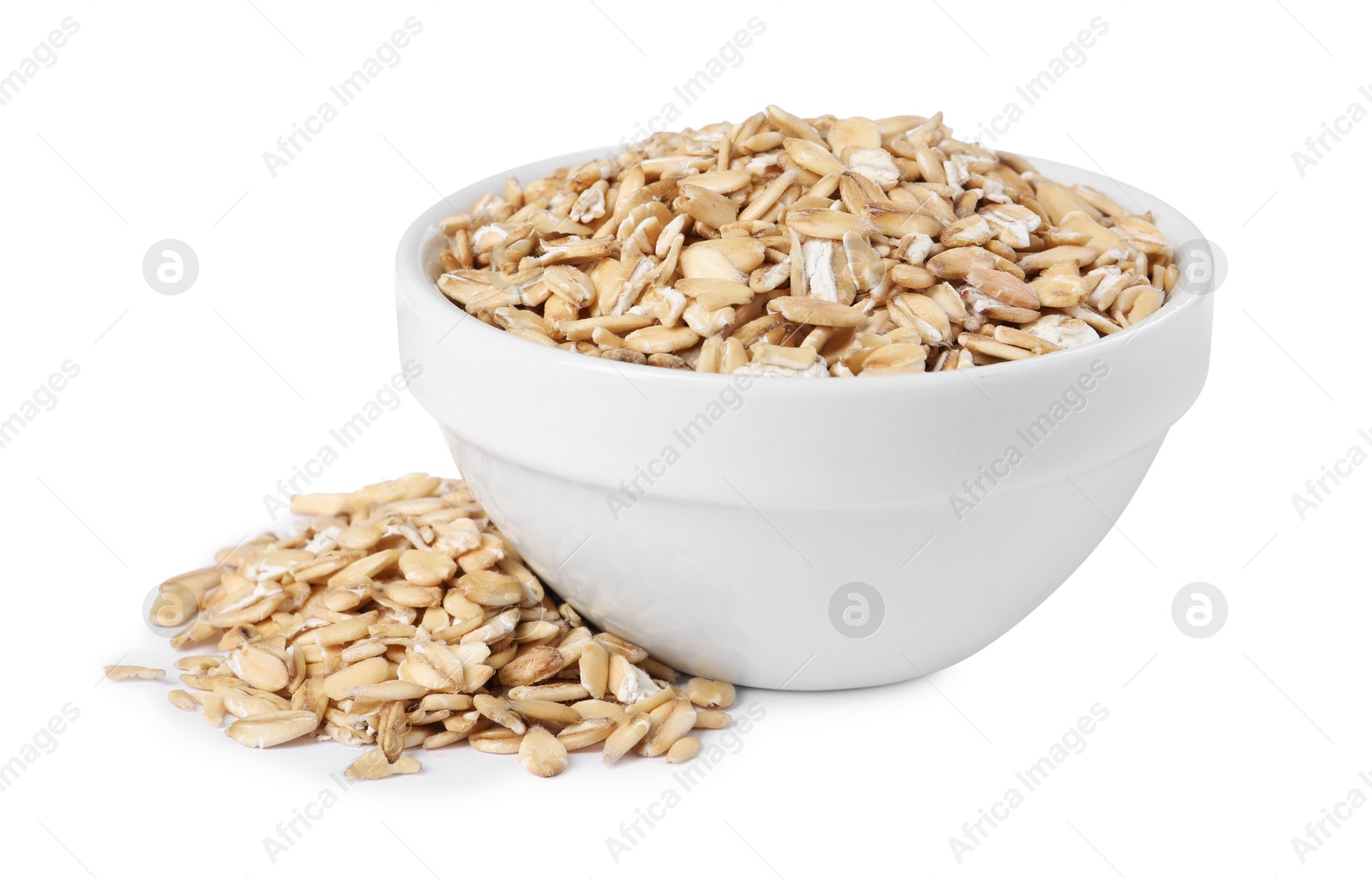 Photo of Dry oat flakes in bowl isolated on white