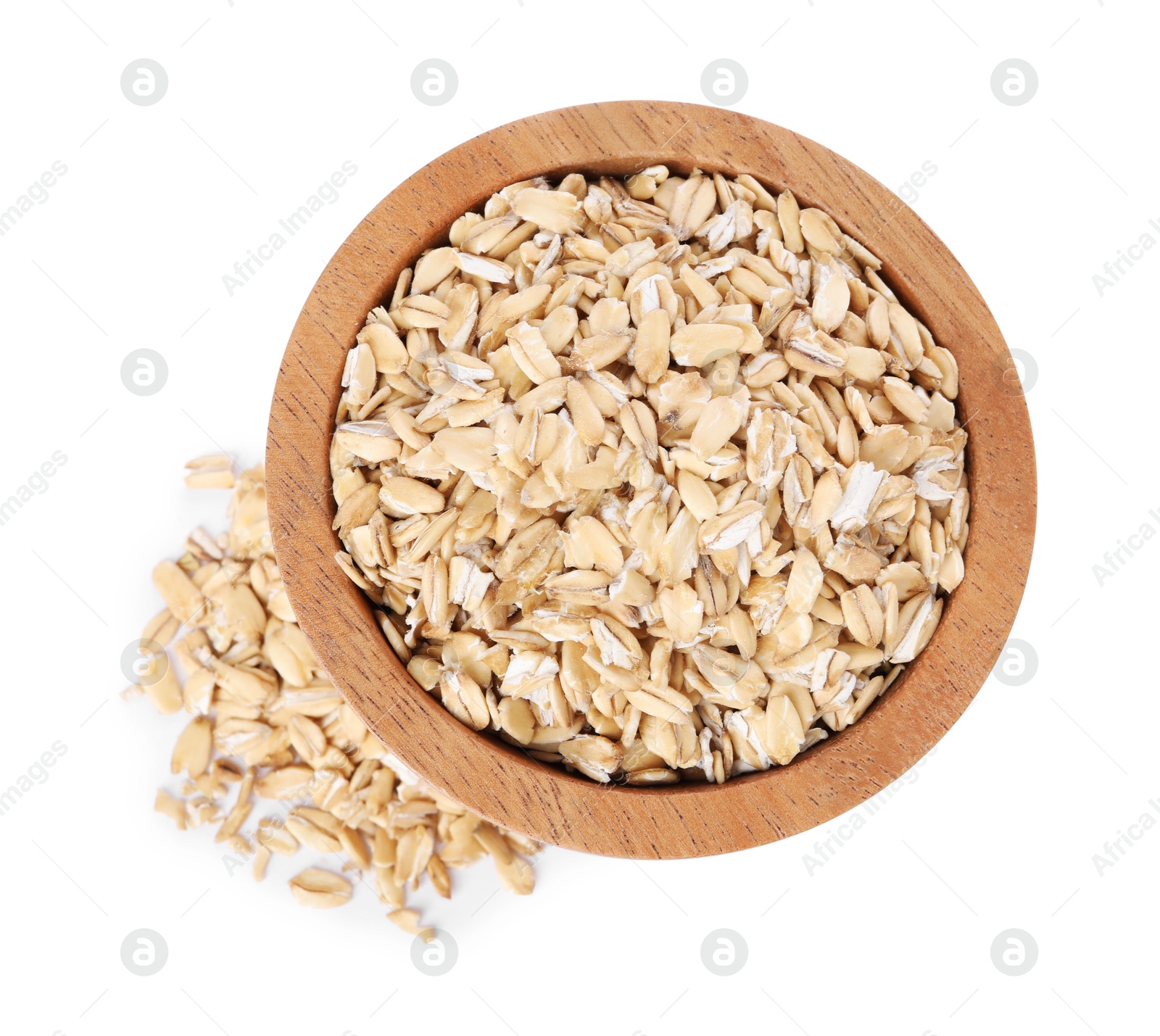 Photo of Dry oat flakes in wooden bowl isolated on white, top view