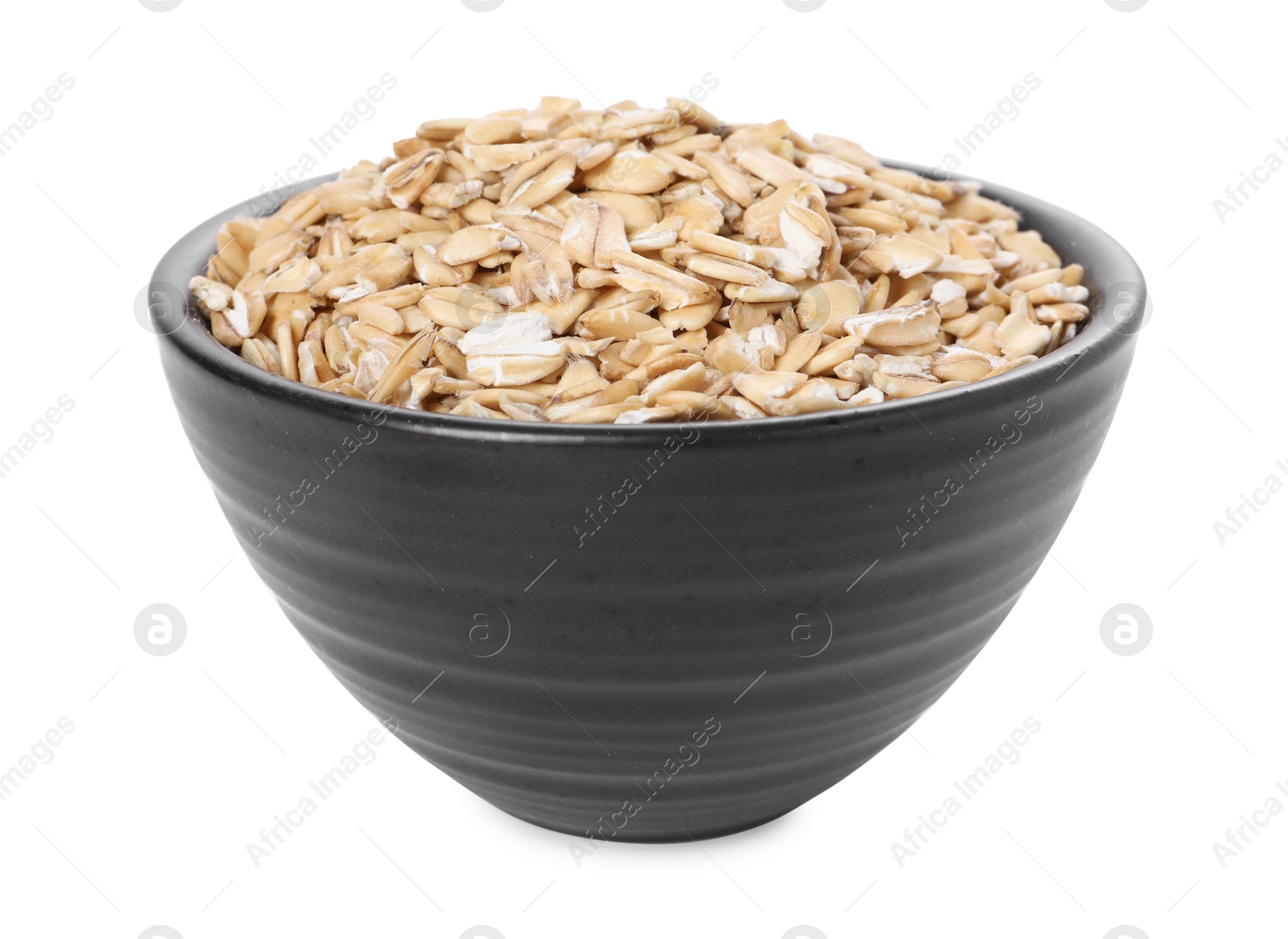 Photo of Dry oat flakes in bowl isolated on white