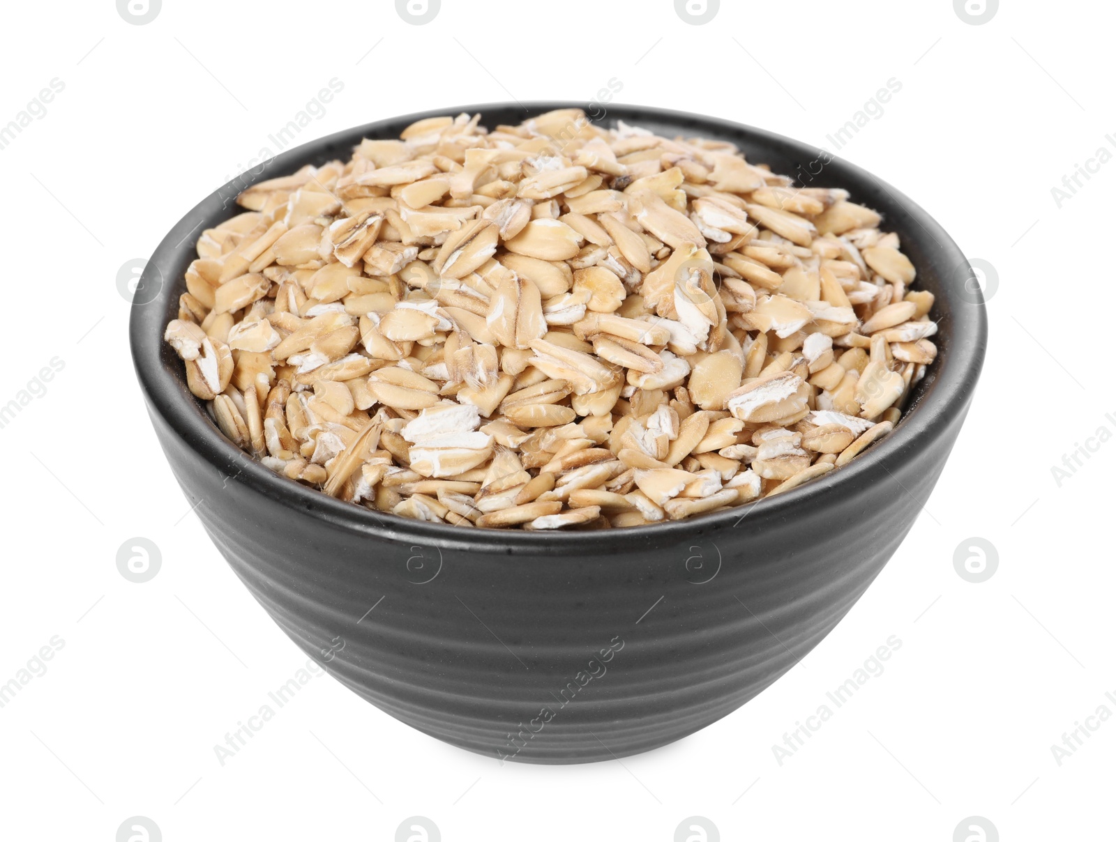 Photo of Dry oat flakes in bowl isolated on white