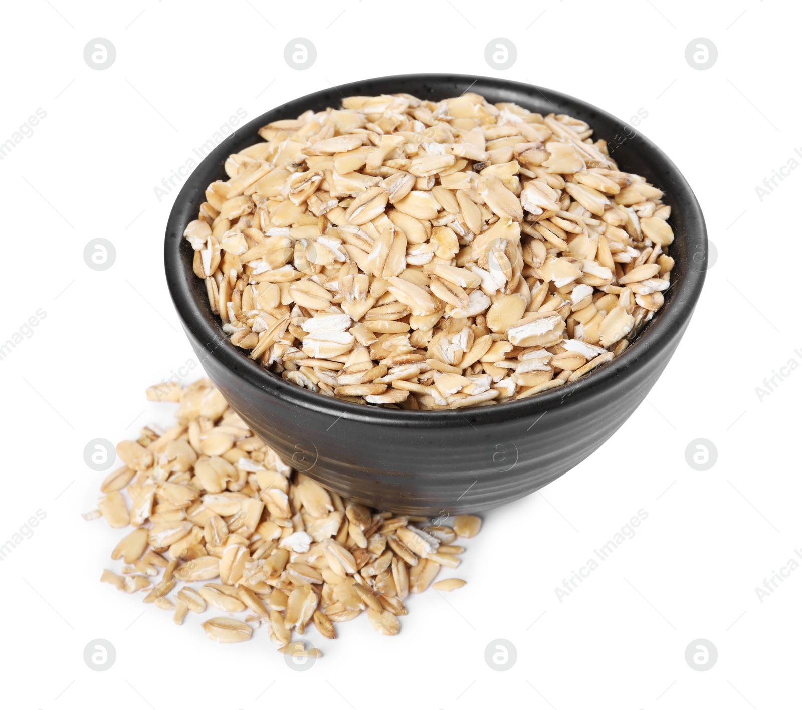 Photo of Dry oat flakes in bowl isolated on white