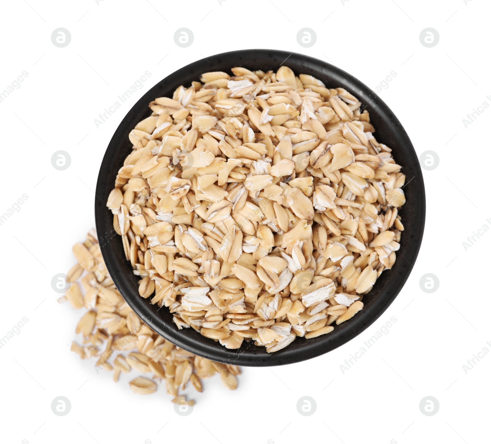 Photo of Dry oat flakes in bowl isolated on white, top view