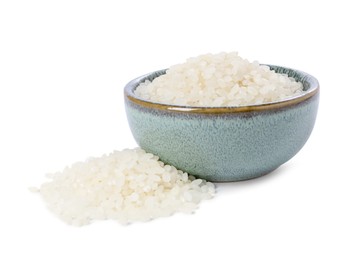 Raw rice in bowl isolated on white