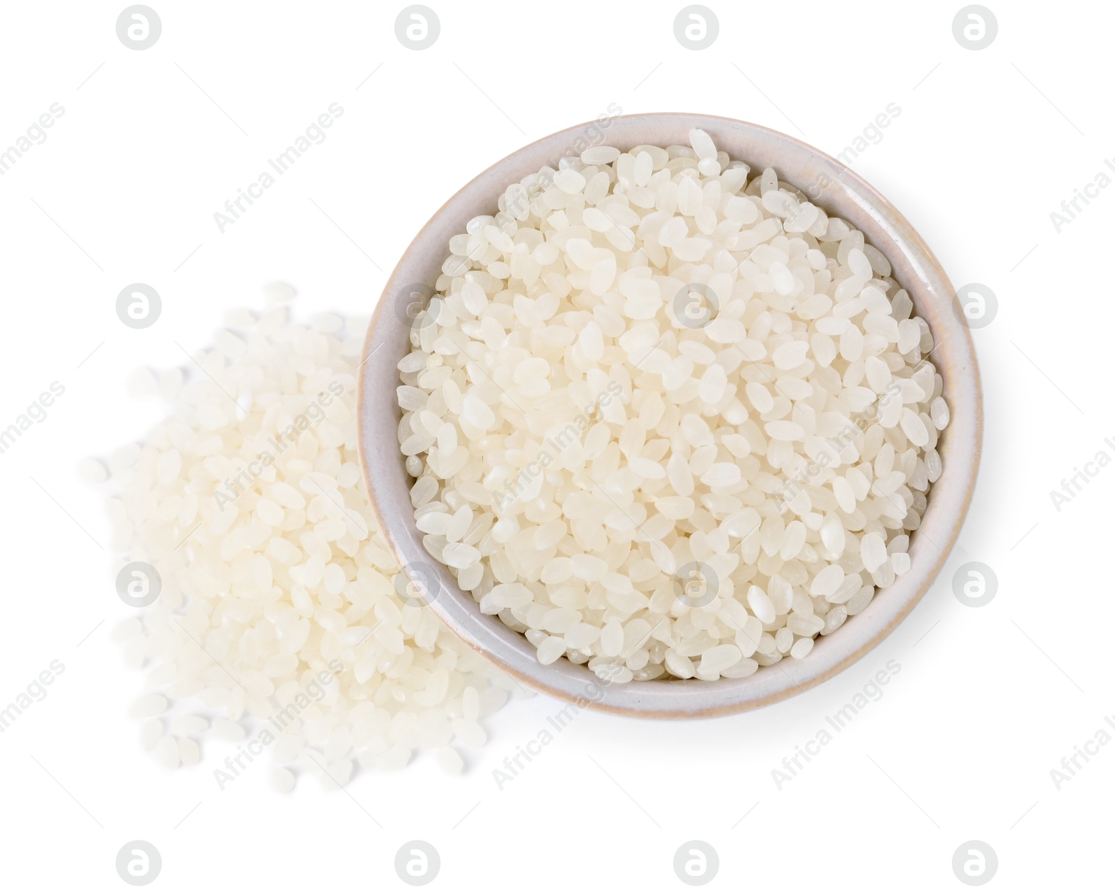 Photo of Raw rice in bowl isolated on white, top view