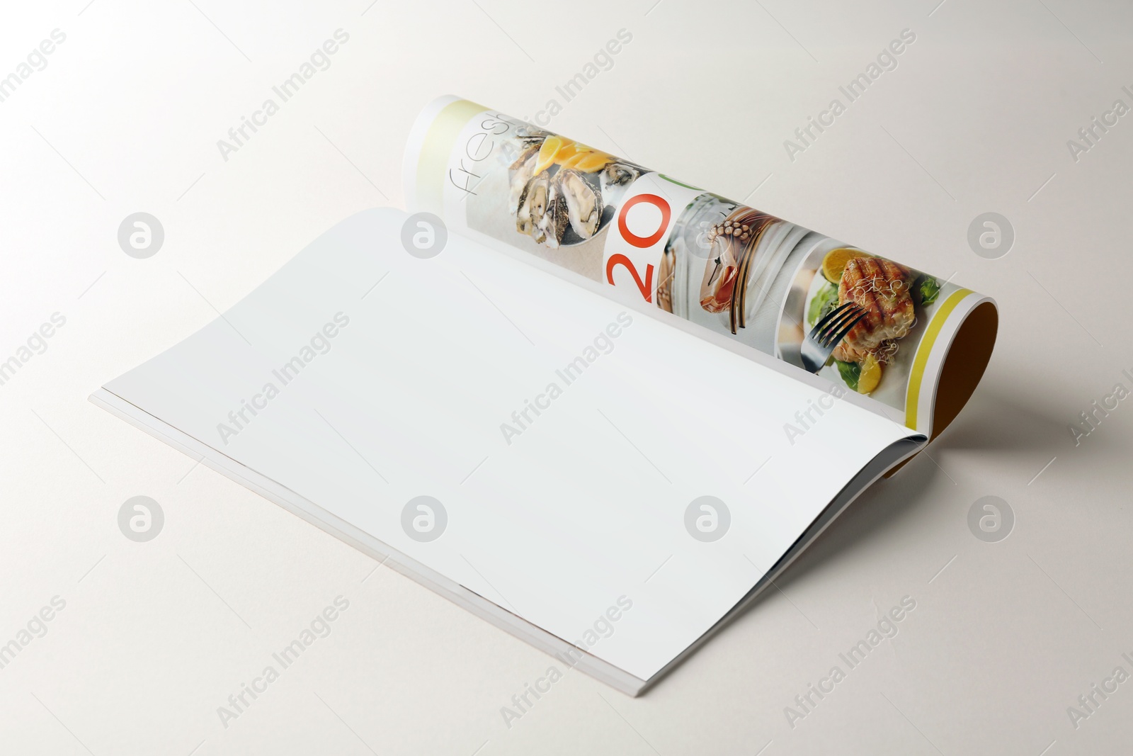 Photo of Open magazine on white background. Mockup for design