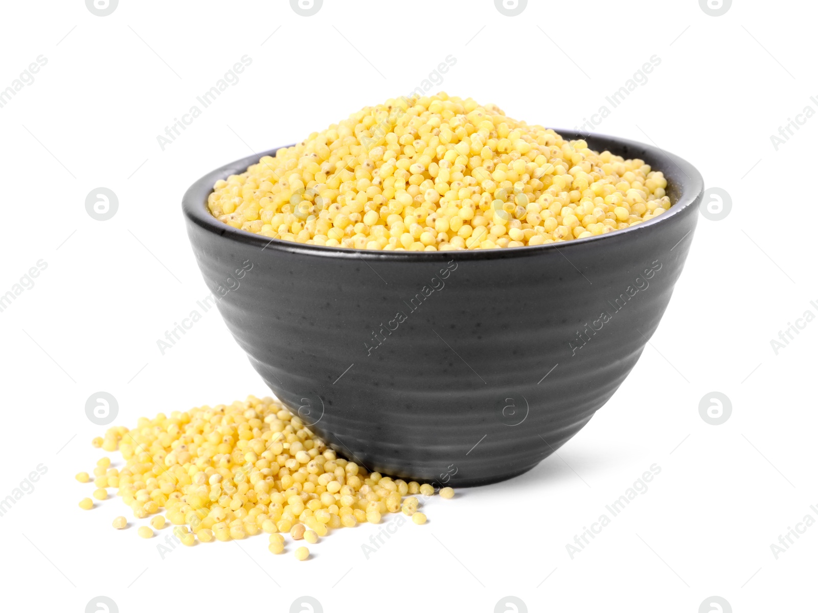 Photo of Millet groats in bowl isolated on white