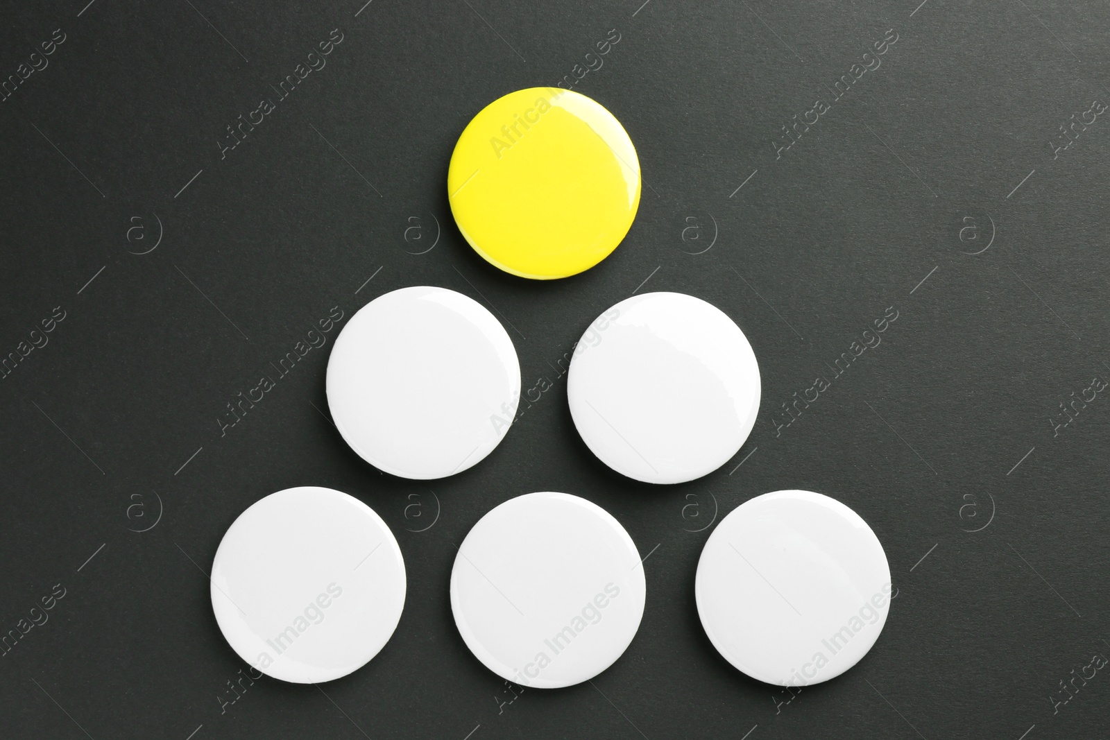 Photo of Button badges on black background, flat lay. Mockup for design