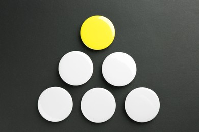 Photo of Button badges on black background, flat lay. Mockup for design