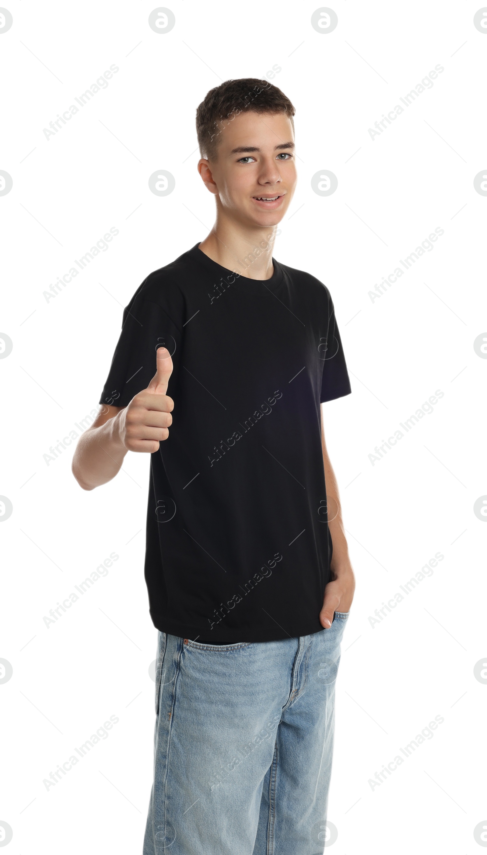 Photo of Teenage boy wearing black t-shirt and showing thumbs up on white background